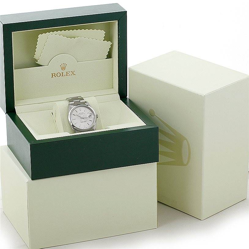 The Rolex Date 15200 Men's Stainless Steel Silver Dial 15200 Men's Stainless Steel Silver Dial watch is shown front-facing, housed in a green and beige Rolex box with cleaning cloths inside the lid.