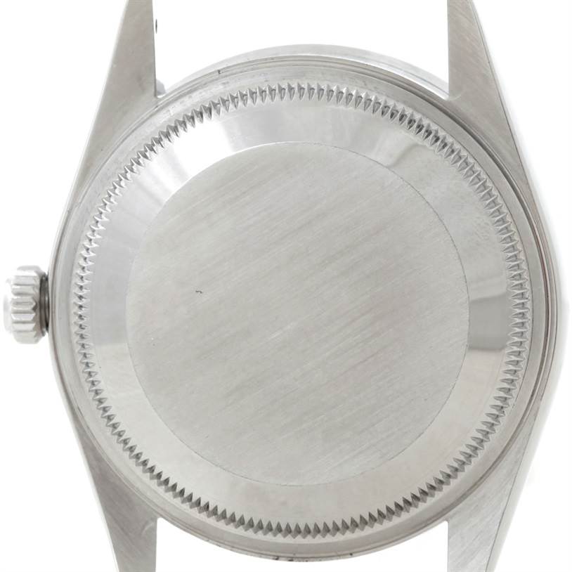 The image shows the back view of a Rolex Date 15210 Men's Stainless Steel Silver Dial 15210 Men's Stainless Steel Silver Dial model watch, highlighting the case back and lugs.