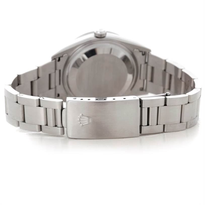 The image shows the back view of a Rolex Date 15210 Men's Stainless Steel Silver Dial 15210 Men's Stainless Steel Silver Dial model watch, highlighting the clasp and metal bracelet.