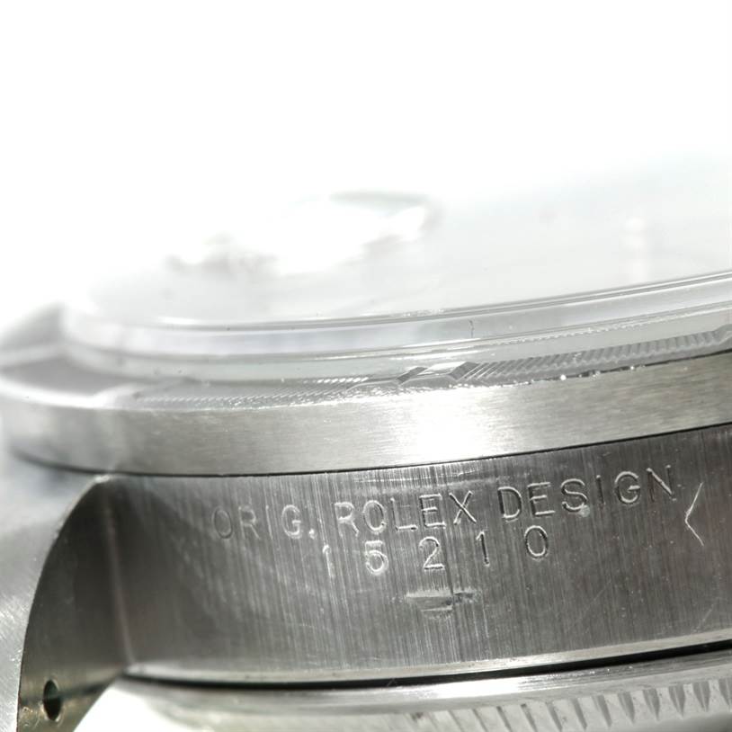 This close-up image shows the side profile of a Rolex Date 15210 Men's Stainless Steel Silver Dial 15210 Men's Stainless Steel Silver Dial model watch, highlighting the bezel and engraved model number.