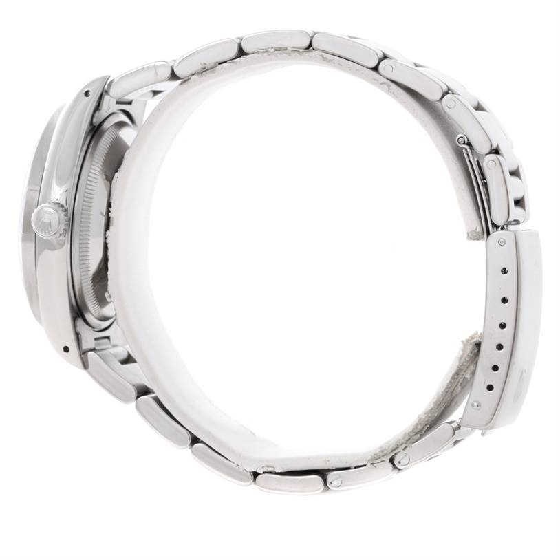 The image shows a side view of a Rolex Date 15210 Men's Stainless Steel Black Dial 15210 Men's Stainless Steel Black Dial model watch, highlighting its bracelet and crown.