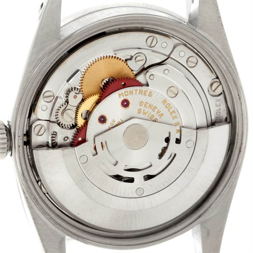 The image shows the back view of the Rolex Date 15210 Men's Stainless Steel Black Dial 15210 Men's Stainless Steel Black Dial model watch, revealing its internal mechanism and parts.