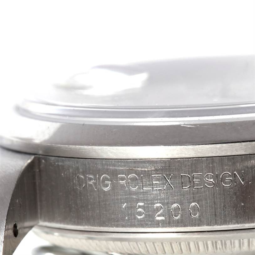 This close-up image shows the side case of a Rolex Date 15200 Men
s Stainless Steel Silver Dial 15200 Men
s Stainless Steel Silver Dial model, highlighting its engraved model number, "15200."