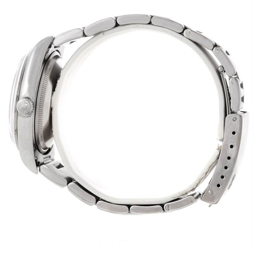 The image shows a side view of a Rolex Date 15200 Men's Stainless Steel White Dial 15200 Men's Stainless Steel White Dial watch, focusing on the case, crown, and bracelet.