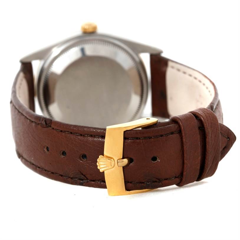 The image shows the back case and leather strap with a gold buckle of a Rolex Date 15203 Men's Steel and Gold (two tone) Grey Dial 15203 Men's Steel and Gold (two tone) Grey Dial model watch.