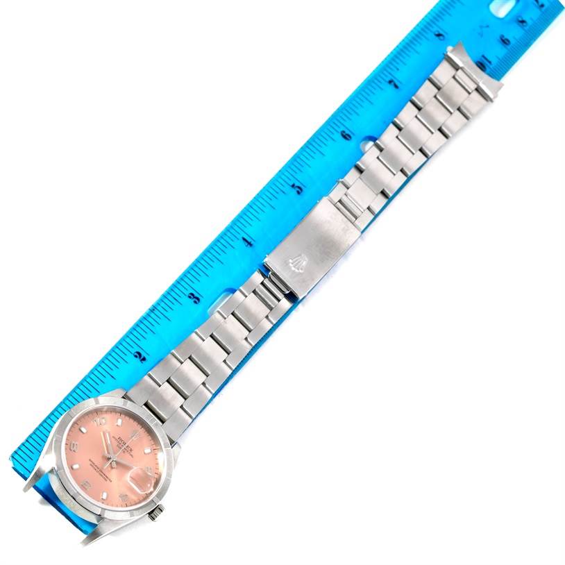 The Rolex Date 15210 Men's Stainless Steel Pink Dial 15210 Men's Stainless Steel Pink Dial model watch is shown from an overhead angle, featuring its face, bezel, bracelet, and clasp.