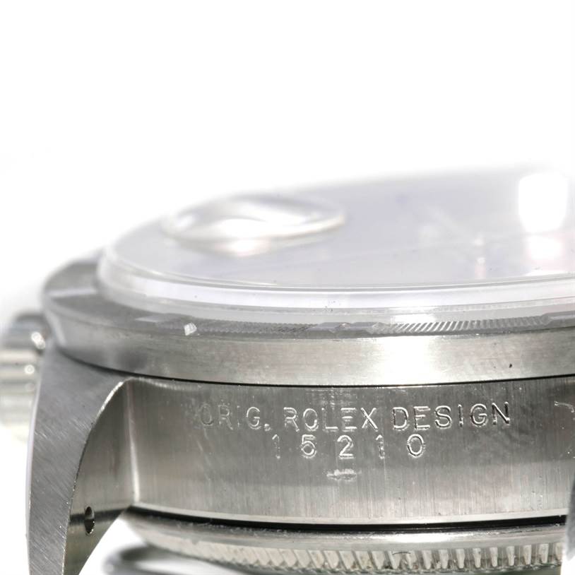 The image shows a close-up side view of the Date model by Rolex, highlighting the casing and engraved serial number.