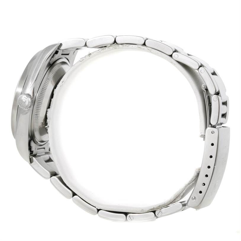 The image shows a side view of a Rolex Date 15210 Men's Stainless Steel Pink Dial 15210 Men's Stainless Steel Pink Dial model watch, focusing on the case, bracelet, and clasp.