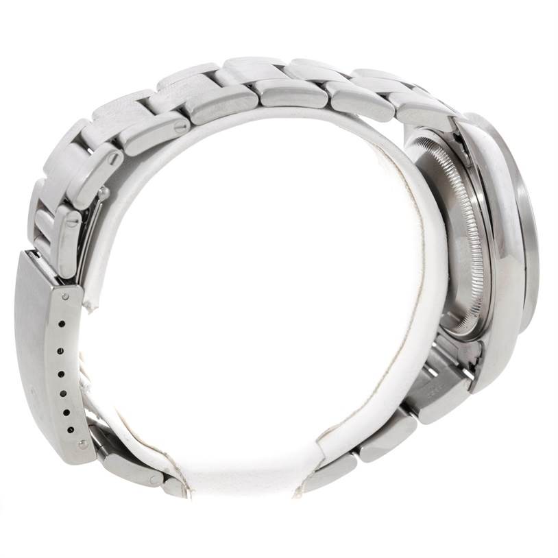 The image shows a side angle of a Rolex Date 15210 Men's Stainless Steel Pink Dial 15210 Men's Stainless Steel Pink Dial watch, highlighting the bracelet and partially the case back.