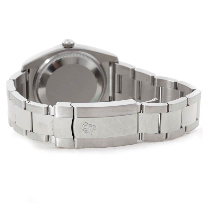 This image shows the back view of a Rolex Date 115234 Men's Stainless Steel Silver Dial 115234 Men's Stainless Steel Silver Dial model watch, highlighting the case back and the bracelet with the clasp.
