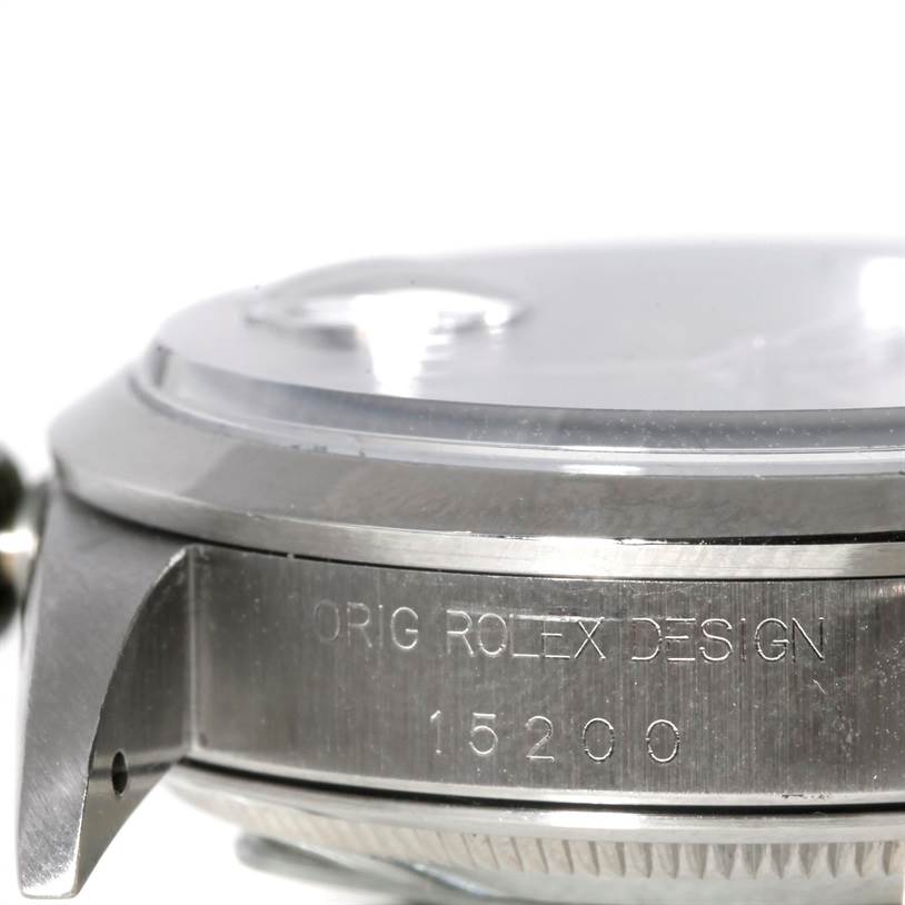 The image shows a close-up side view of the Rolex Date 15200 Men's Stainless Steel Blue Dial 15200 Men's Stainless Steel Blue Dial model watch case, highlighting the crown and engraved design number.