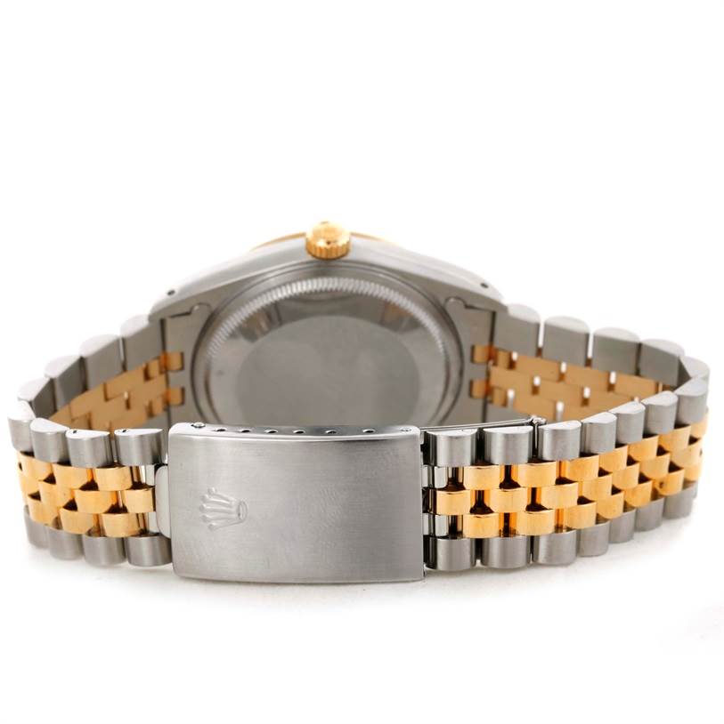 The image shows the back case and clasp of a Rolex Date 15223 Men's Steel and Gold (two tone) Champagne Dial 15223 Men's Steel and Gold (two tone) Champagne Dial model watch, highlighting its two-tone bracelet.