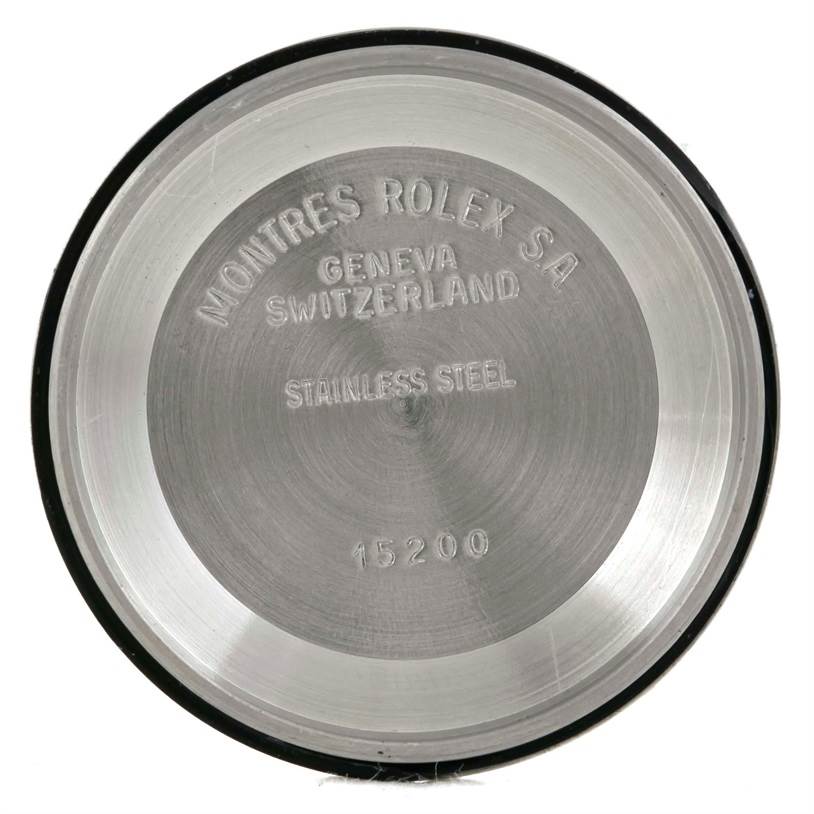 This image shows the engraved inside back cover of a Rolex Date 15223 Men's Steel and Gold (two tone) Champagne Dial 15223 Men's Steel and Gold (two tone) Champagne Dial model watch, highlighting its stainless steel material and origin.