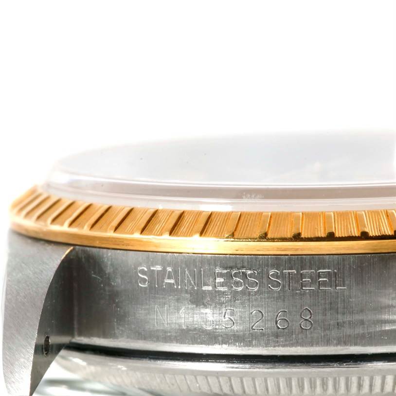 The image shows a close-up side view of the stainless steel case and bezel of a Rolex Date 15223 Men's Steel and Gold (two tone) Champagne Dial 15223 Men's Steel and Gold (two tone) Champagne Dial watch.