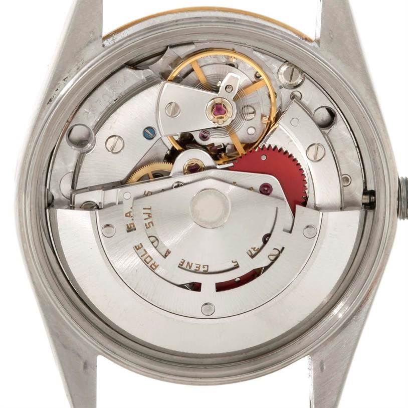This image shows the internal mechanism of a Rolex Date 15053 Men's Stainless Steel Champagne Dial 15053 Men's Stainless Steel Champagne Dial model watch, viewed from the back, highlighting gears and the oscillating weight.