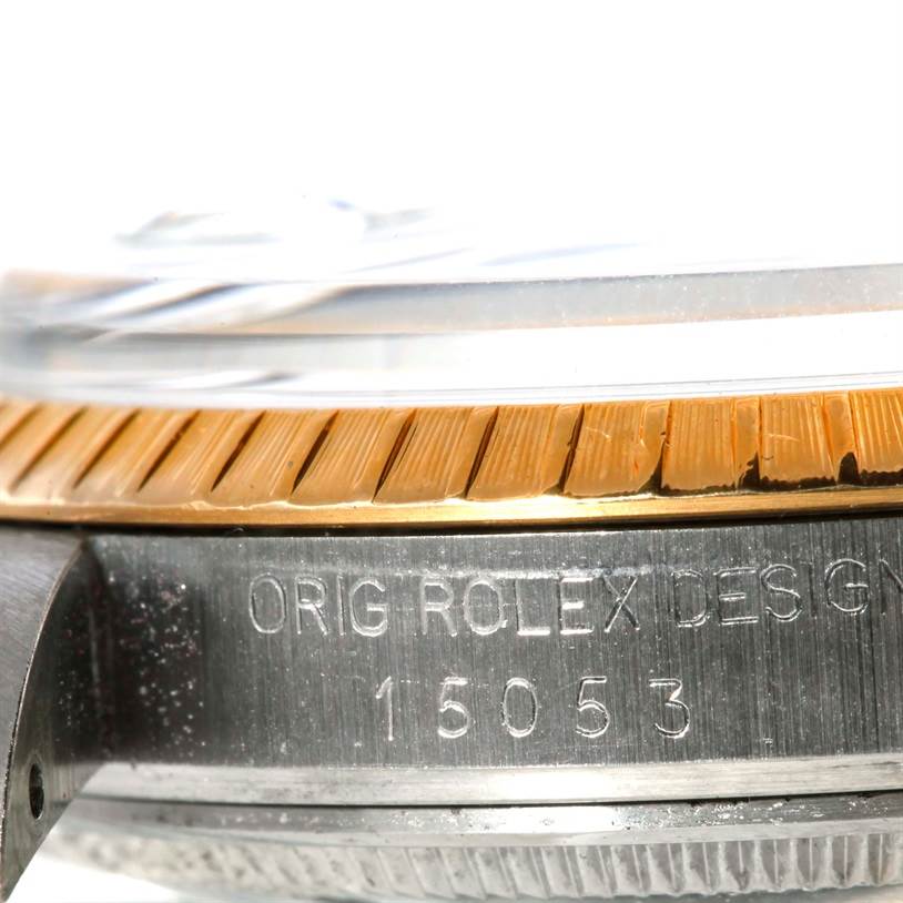 This is a detailed close-up of the bezel and case side of the Rolex Date 15053 Men's Stainless Steel Champagne Dial 15053 Men's Stainless Steel Champagne Dial model, showing the model number engraving.