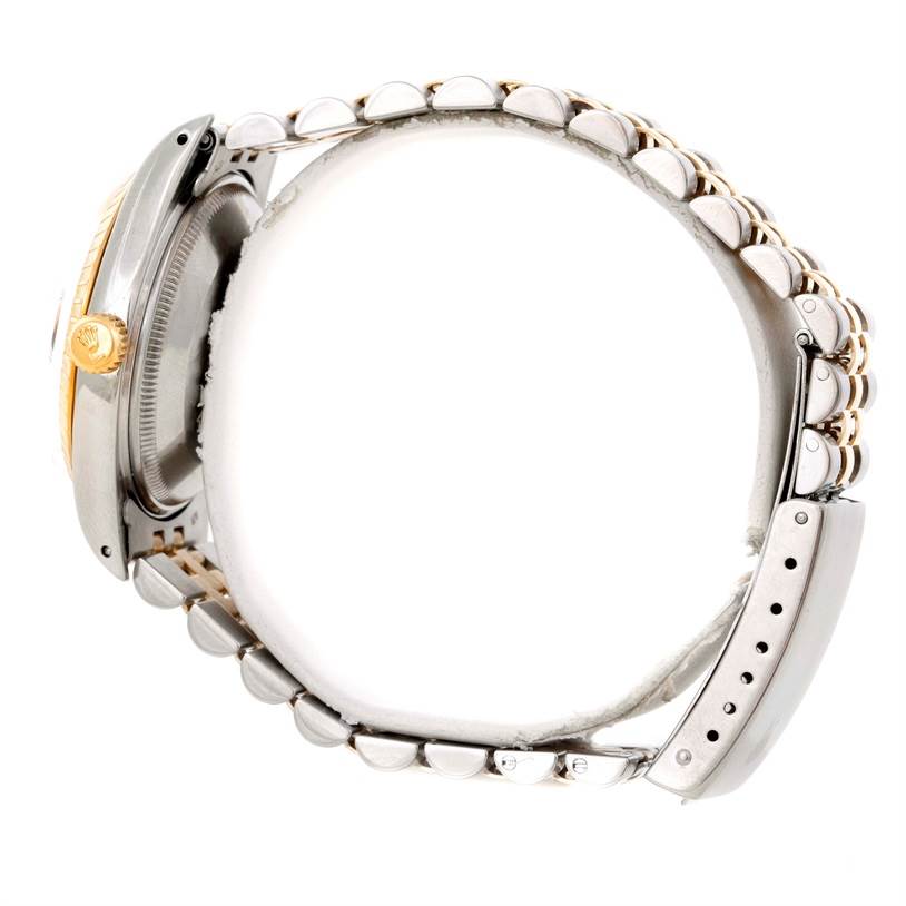 The image shows a side view of a Rolex Date 15053 Men's Stainless Steel Champagne Dial 15053 Men's Stainless Steel Champagne Dial model watch, highlighting the case, crown, and its two-tone bracelet.