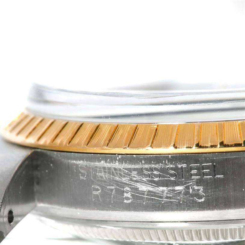 The image shows a close-up side view of the bezel and case of a Rolex Date 15053 Men's Stainless Steel Blue Dial 15053 Men's Stainless Steel Blue Dial model watch.