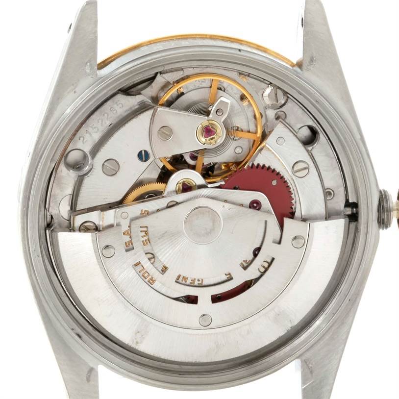 The image shows the interior mechanics of a Rolex Date 15053 Men's Stainless Steel Blue Dial 15053 Men's Stainless Steel Blue Dial model watch from the back, revealing its movement components.