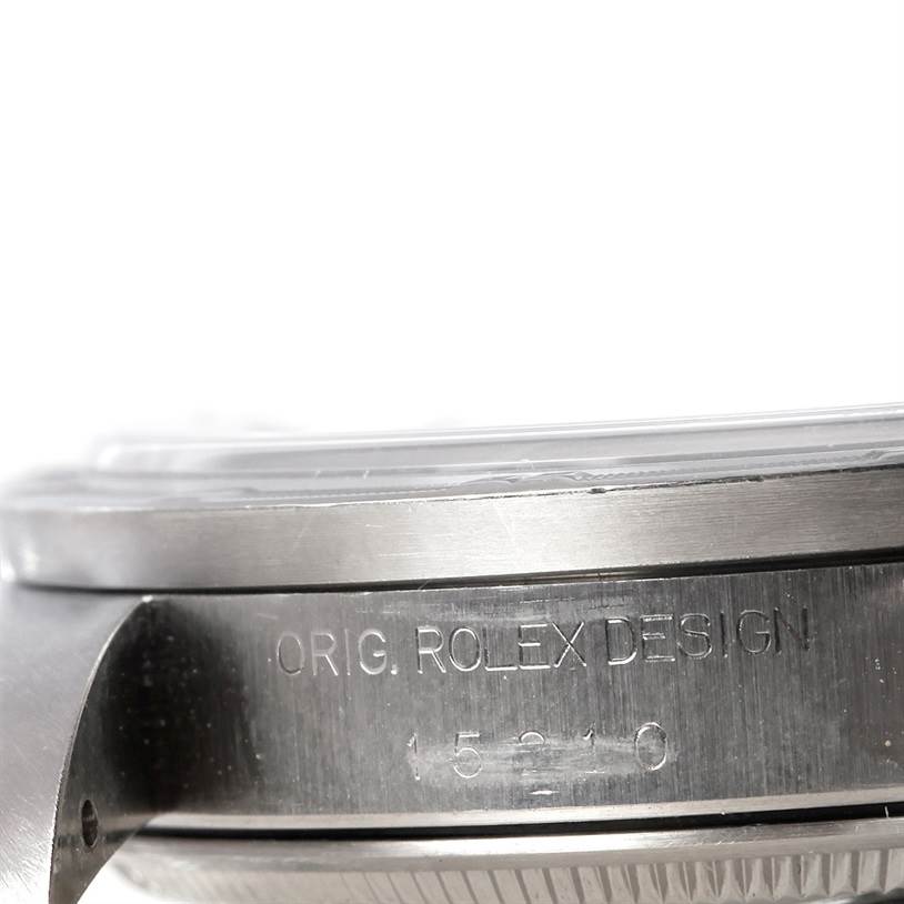 The image shows a close-up side view of the case and bezel of a Rolex Date 15210 Men's Stainless Steel Black Dial 15210 Men's Stainless Steel Black Dial watch, highlighting the engraved text and design.