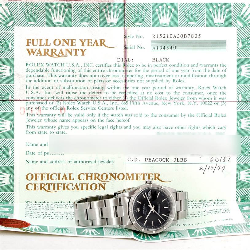 The image shows a Rolex Date 15210 Men's Stainless Steel Black Dial 15210 Men's Stainless Steel Black Dial watch placed atop its warranty and certification documents.