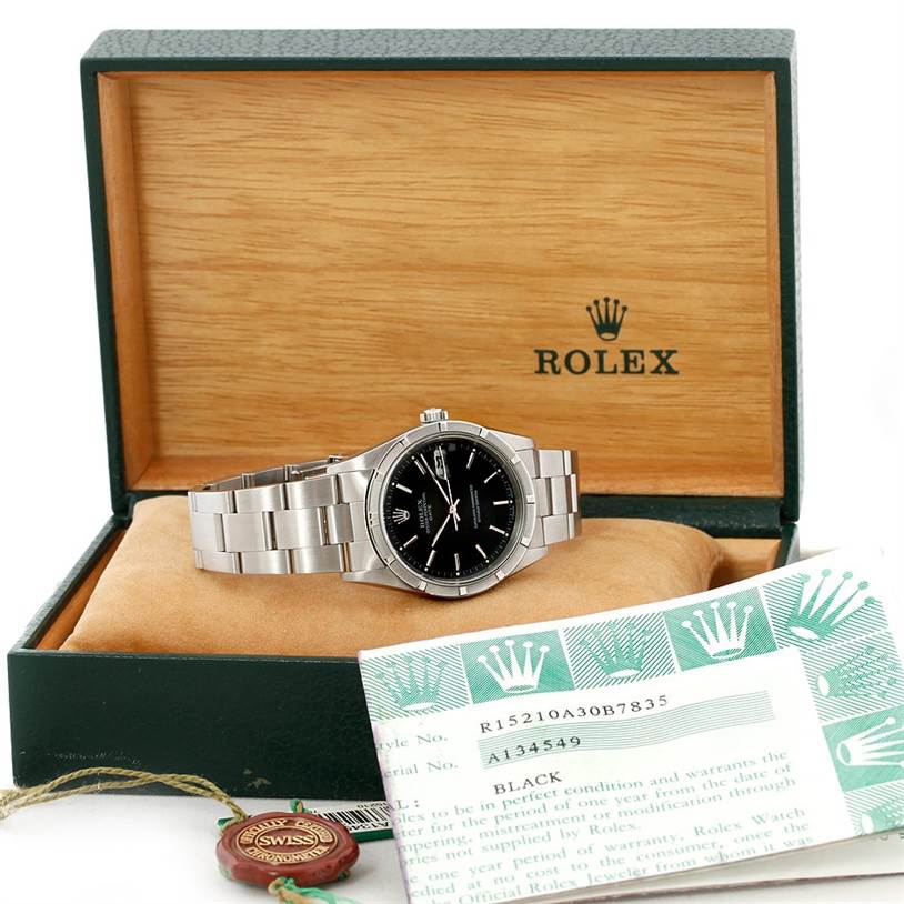 The Rolex Date 15210 Men's Stainless Steel Black Dial 15210 Men's Stainless Steel Black Dial model watch is angled front-facing, showing the dial, bracelet, and accompanying box and papers.
