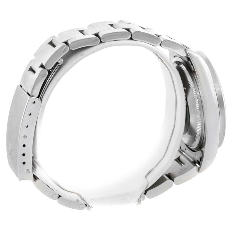 The image shows the side view of a Rolex Date 15210 Men's Stainless Steel White Dial 15210 Men's Stainless Steel White Dial model, highlighting its bracelet and clasp.