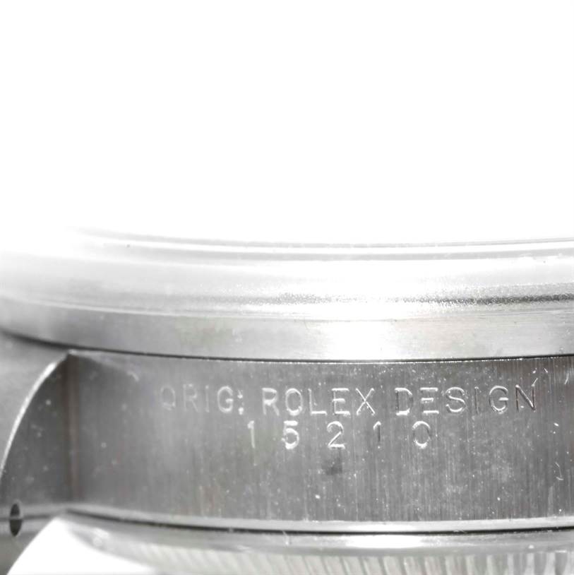 The image shows a close-up of the side of a Rolex Date 15210 Men's Stainless Steel White Dial 15210 Men's Stainless Steel White Dial watch case, highlighting the "ROLEX DESIGN 15210" engraving.