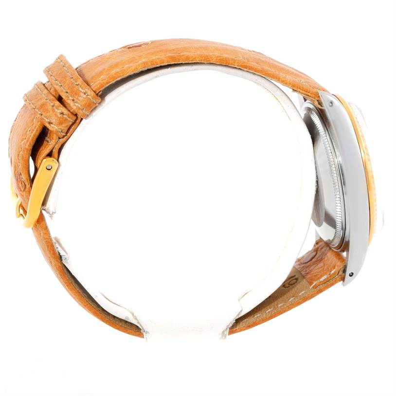 This is a side view of a Rolex Date 15053 Men's Stainless Steel Champagne Dial 15053 Men's Stainless Steel Champagne Dial model watch showcasing its case, bezel, and brown leather strap.