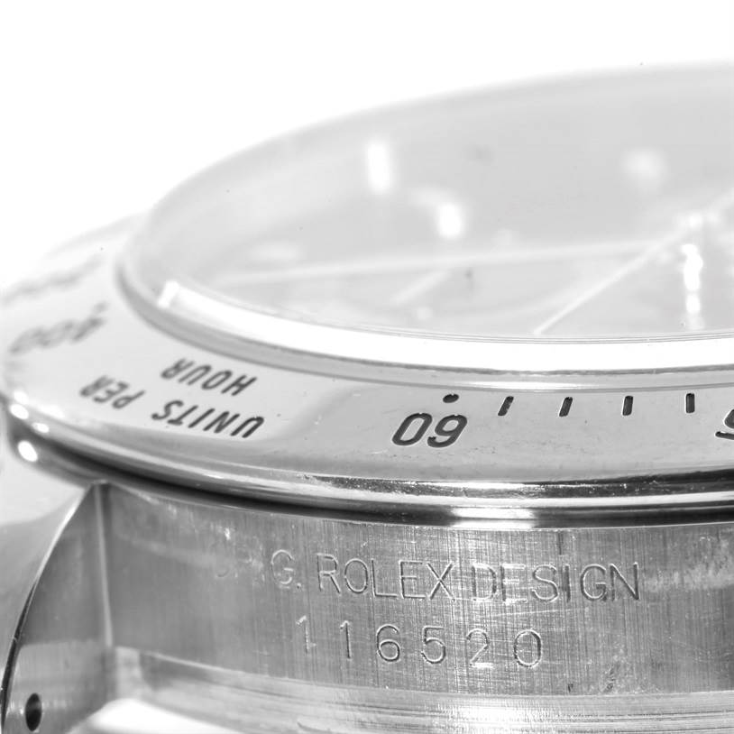 Close-up side angle of the bezel and case of a Rolex Daytona 116520 Men's Stainless Steel Black Dial 116520 Men's Stainless Steel Black Dial watch, showing "UNITS PER HOUR" and model number 116520.