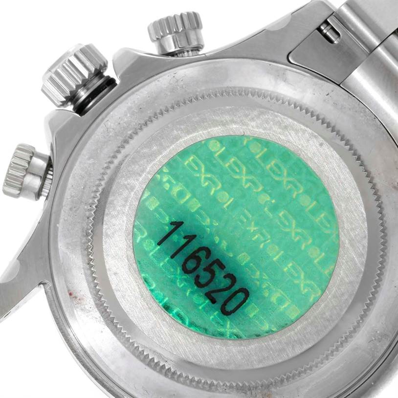 The image shows the case back of a Rolex Daytona 116520 Men's Stainless Steel White Dial 116520 Men's Stainless Steel White Dial watch with the model number 116520 and crown and pushers visible.