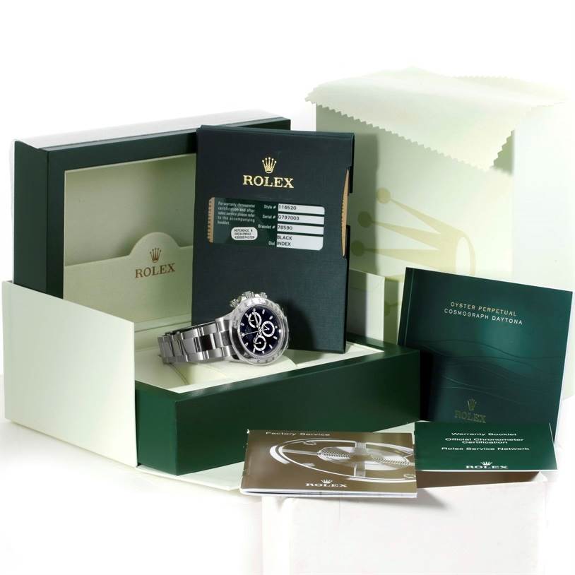 This image shows the Rolex Daytona 116520 Men's Stainless Steel Black Dial 116520 Men's Stainless Steel Black Dial watch with its box, booklet, warranty card, and additional documents from a front angle.