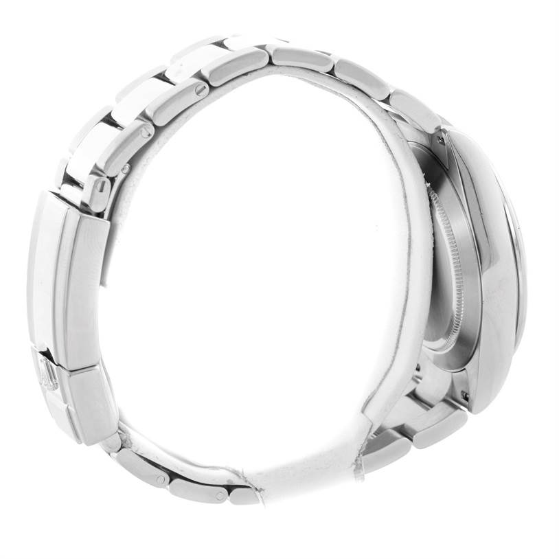 This image shows a side view of the Rolex Daytona 116520 Men's Stainless Steel Black Dial 116520 Men's Stainless Steel Black Dial watch, focusing on the band and caseback.