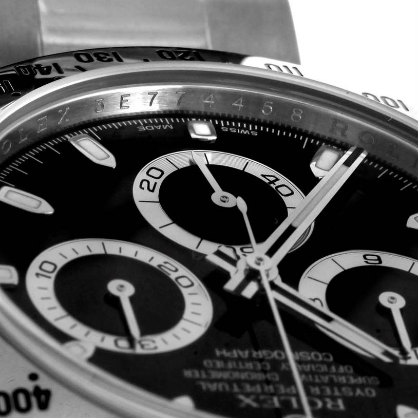 The image shows a close-up of the dial and bezel of a Rolex Daytona 116520 Men's Stainless Steel Black Dial 116520 Men's Stainless Steel Black Dial watch, focusing on the sub-dials and markers.