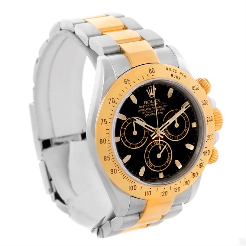 The image shows a Rolex Daytona 116523 Men's Steel and Gold (two tone) Black Dial 116523 Men's Steel and Gold (two tone) Black Dial watch at an angled view, highlighting the bezel, dial, and two-tone bracelet.