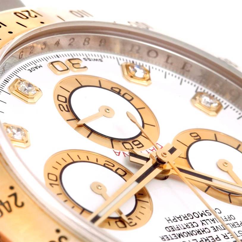 This close-up angle of the Rolex Daytona 116523 Men's White Dial 116523 Men's White Dial watch highlights its dial, sub-dials, and bezel.