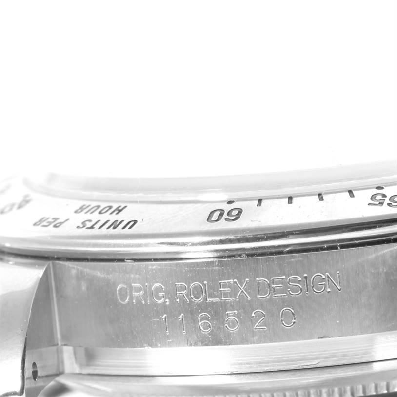The image shows a close-up of the bezel and engraved model number "116520" of a Rolex Daytona 116520 Men's Stainless Steel White Dial 116520 Men's Stainless Steel White Dial watch.