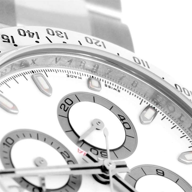 The close-up image shows the dial, subdials, and part of the bezel of a Rolex Daytona 116520 Men's Stainless Steel White Dial 116520 Men's Stainless Steel White Dial watch. 