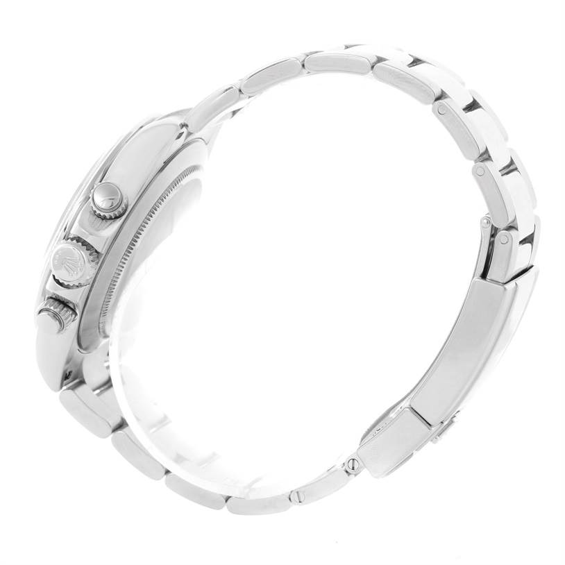 The image shows a side view of a Rolex Daytona 116520 Men's Stainless Steel Black Dial 116520 Men's Stainless Steel Black Dial watch focusing on the crown and pushers, along with the bracelet.