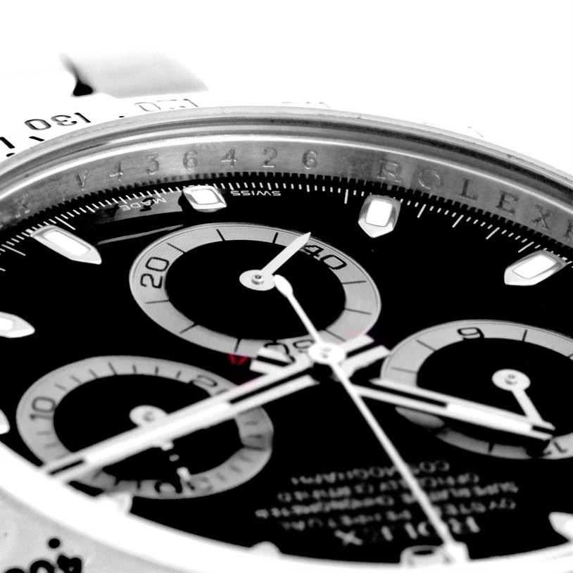 This close-up image of a Rolex Daytona 116520 Men's Stainless Steel Black Dial 116520 Men's Stainless Steel Black Dial watch showcases the dial, subdials, and part of the bezel from a tilted angle.