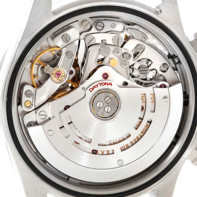 The image shows a close-up view of the movement and internal mechanics of a Rolex Daytona 116520 Men's Stainless Steel Black Dial 116520 Men's Stainless Steel Black Dial watch.