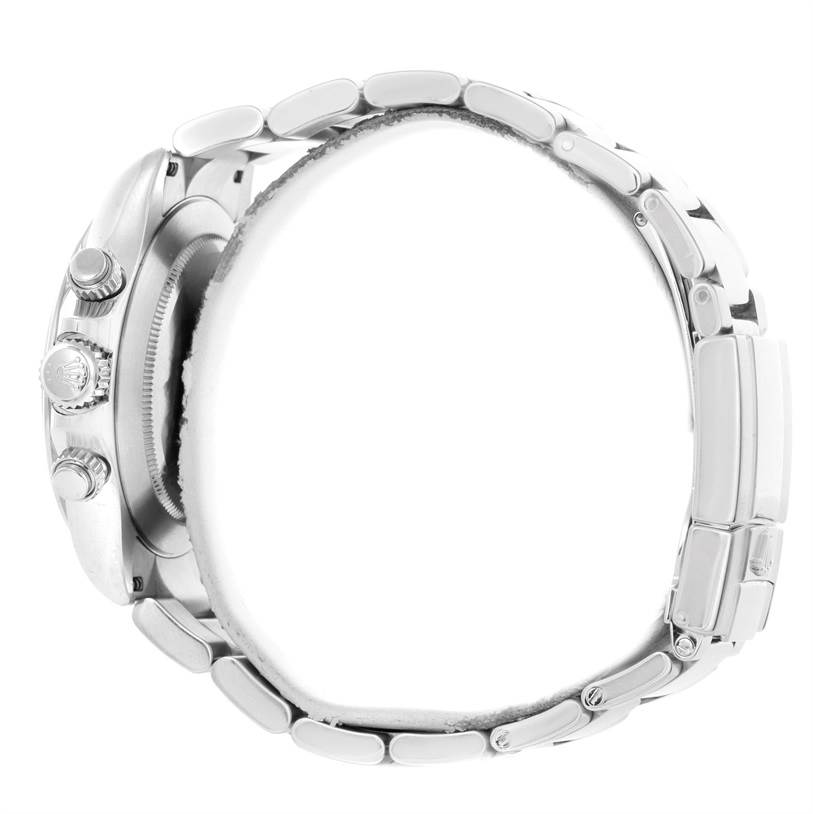 This side view of a Rolex Daytona 116520 Men's Stainless Steel Black Dial 116520 Men's Stainless Steel Black Dial watch shows the crown, pushers, case, and part of the bracelet.