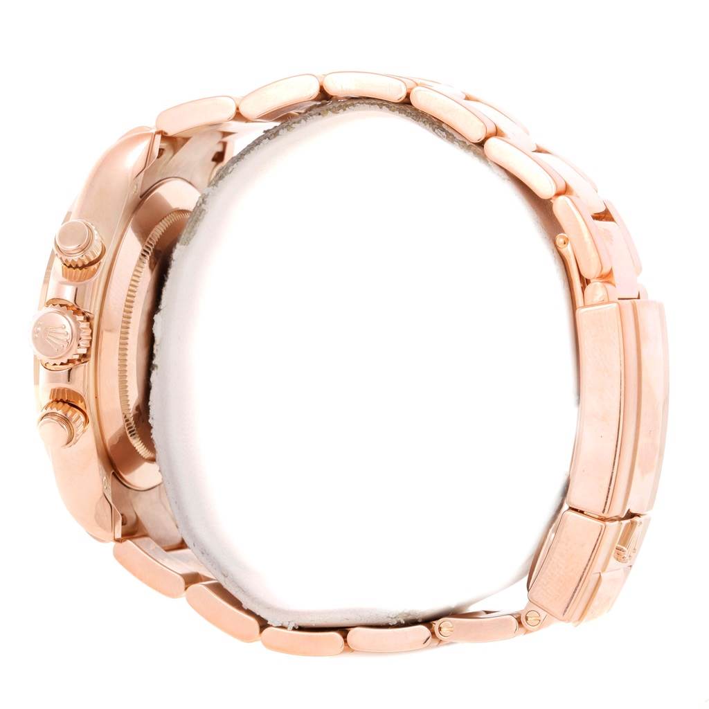 The image shows a side view of the Rolex Daytona 116505 Men's Rose Gold Black Dial 116505 Men's Rose Gold Black Dial watch, highlighting its crown, pushers, and rose gold bracelet.