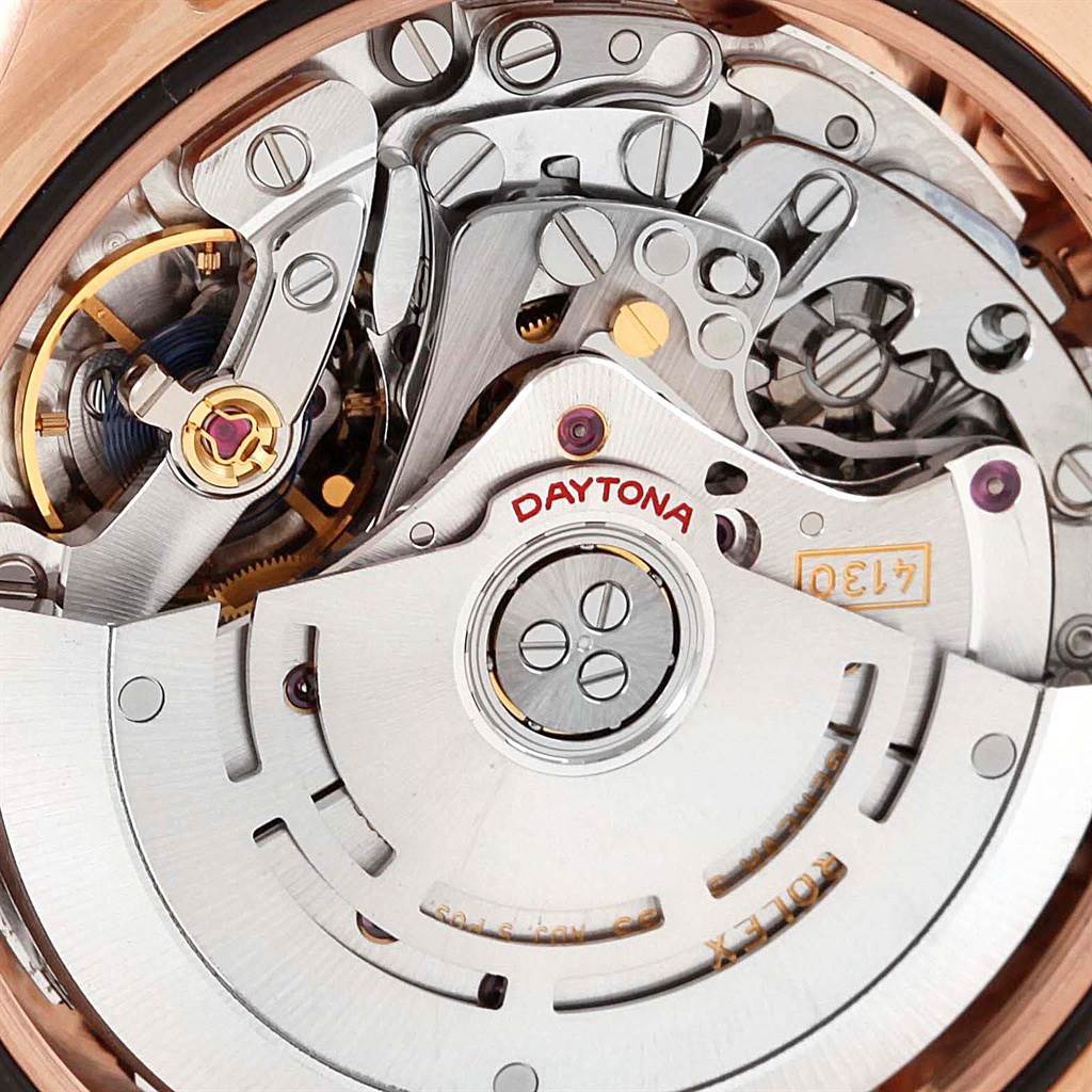 The image shows a close-up view of parts of the movement mechanism of a Rolex Daytona 116505 Men's Rose Gold Black Dial 116505 Men's Rose Gold Black Dial watch.