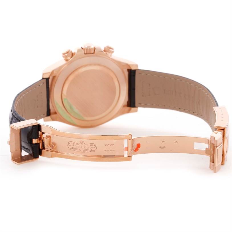 The image shows the back and open clasp of a Rolex Daytona 116515LN Men's Rose Gold Brown Dial 116515LN Men's Rose Gold Brown Dial watch, highlighting the strap and case back.