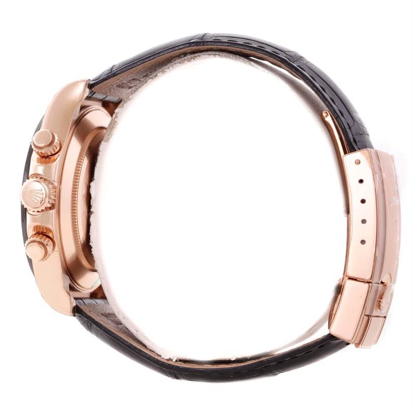 The image shows a side view of a Rolex Daytona 116515LN Men's Rose Gold Brown Dial 116515LN Men's Rose Gold Brown Dial watch, focusing on the crown, pushers, and leather strap with a clasp.