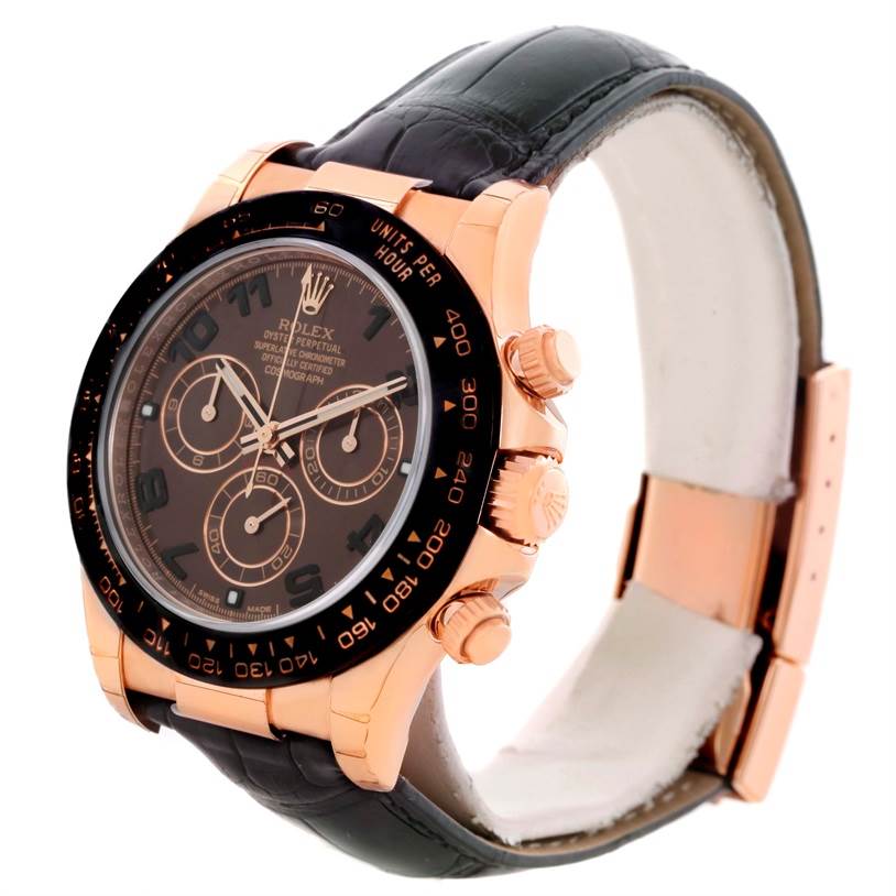 The image shows a side angle of the Rolex Daytona 116515LN Men's Rose Gold Brown Dial 116515LN Men's Rose Gold Brown Dial watch, highlighting the case, bezel, pushers, and part of the leather strap.