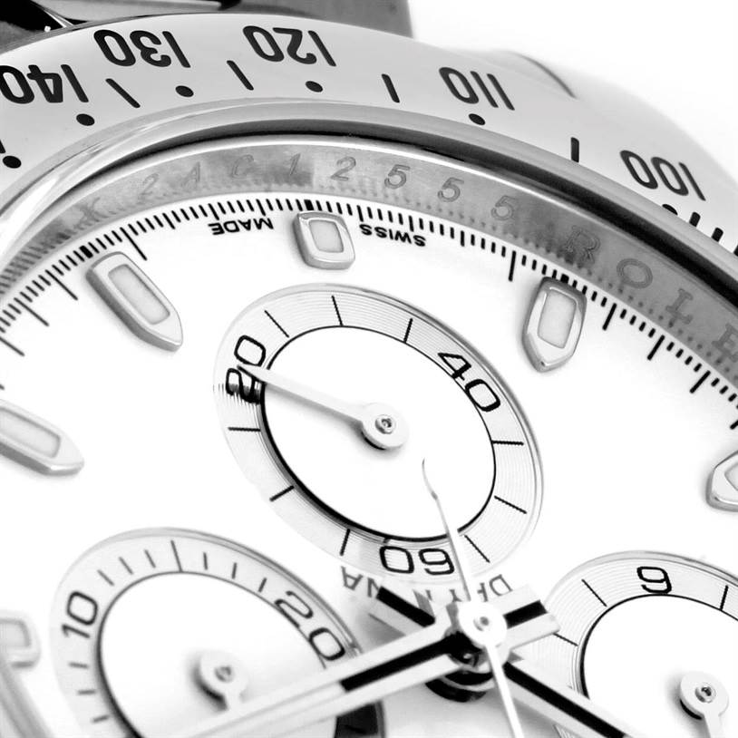 The image shows a close-up of the dial and bezel of a Rolex Daytona 116520 Men's Stainless Steel White Dial 116520 Men's Stainless Steel White Dial watch, focusing on its subdials and markers.
