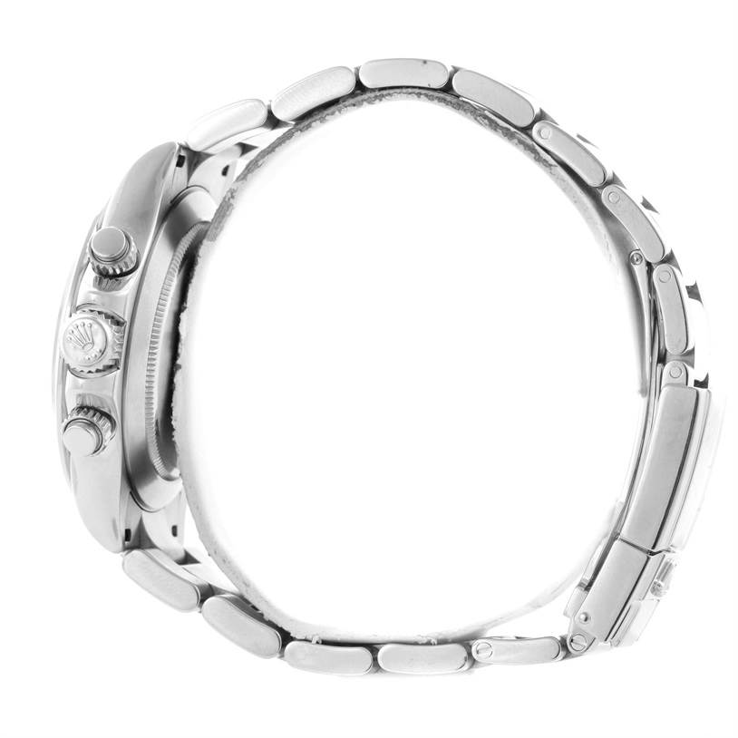 The image shows a side profile of the Rolex Daytona 116520 Men's Stainless Steel White Dial 116520 Men's Stainless Steel White Dial watch, displaying the crown, pushers, and part of the bracelet.