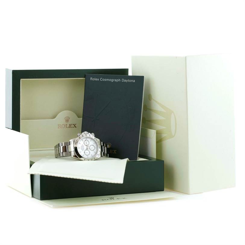 The image shows a Rolex Daytona 116520 Men's Stainless Steel White Dial 116520 Men's Stainless Steel White Dial watch placed in its box, accompanied by booklets and packaging accessories.